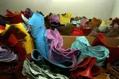 Aisle between leather shelves at METAFORA wholesale